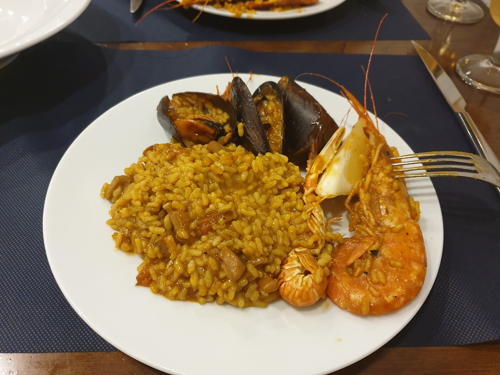 Seafood paella with mussels, prawns and rice